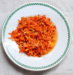 
Raw grated carrot salad flavored by Provence herbs, chopped walnuts, olive oil and lemon juice