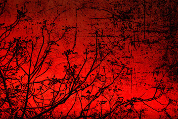 Textured old paper background with spring tree young branches against red sunset sky. Things differing strikingly. Rough radically contrasting background