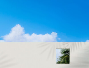 Wall concrete texture with open window and coconut palm leaves against blue sky and clouds,Exterior...