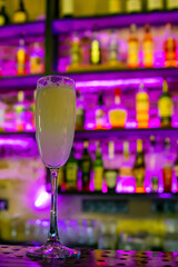 Sour cocktail in glass on the bar.