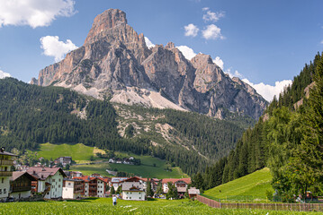 Fototapeta premium Corvara village and Sassongher mountain as seen from the village below, Val Badia, Dolomites, South Tyrol, Italy
