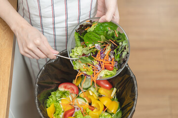 Food waste environment concept, people throwing food garbage into bin prepare to decompose.