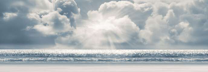 beautiful thunder cloudscape with sun over the glittering sea, natural scene panorama for climate...