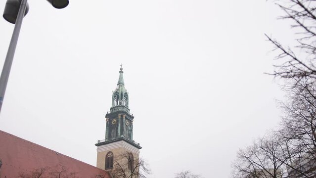 St Mary Church, Marienkirche, parish church in Berlin. On a cloudy day, Berlin, Germany, brick Gothic St Mary's Church Marienkirche, 17th century on Karl Liebknecht Street Karl-Liebknecht-Strasse
