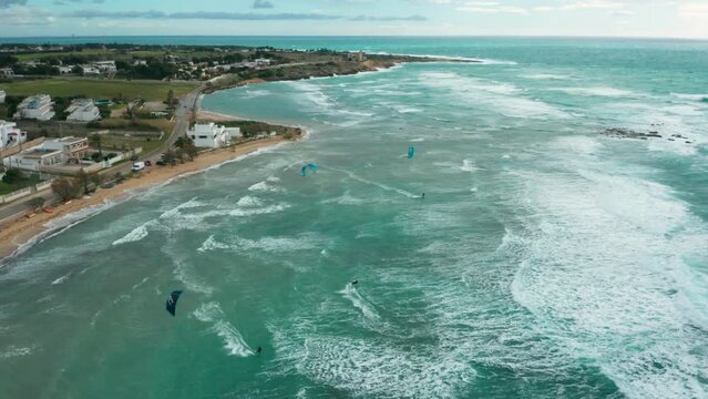 Kate surfing, in Puglia, rough sea, shot from above 14