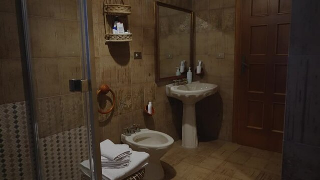 Mediterranean style bathroom interior with shower.