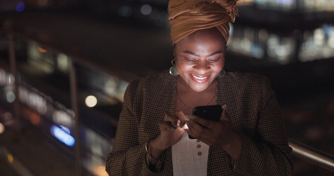 City, Rooftop And Black Woman On A Phone At Night Networking On Social Media Or The Internet. Technology, Happiness And African Lady Browsing Online With A Cellphone On An Outdoor Balcony In A Town.