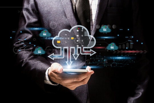 Businessman using smartphone with online cloud documentation database and document management system (DMS) online documentation database and process to manage files.business and technology.