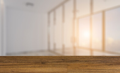 Modern office building interior. 3D rendering.. Sunset.. Background with empty wooden table. Flooring.
