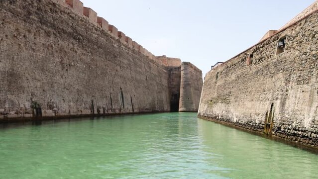 View from a tourist boat of the Royal Walls of Ceuta and its navigable moat