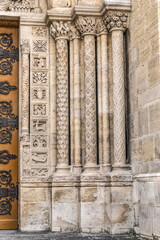 Obraz premium Fragments of the facade of Basilica of Saint-Denis (Basilique royale de Saint-Denis, from 1144) - former medieval abbey church in city of Saint-Denis, a northern suburb of Paris. France.