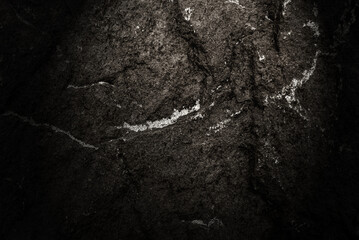 Texture of natural stone with irregularities. Background from a stone with a vignette. Wall