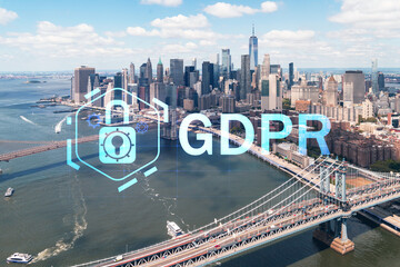 Aerial panoramic city view of Lower Manhattan. Brooklyn and Manhattan bridges over East River, New York, USA. GDPR hologram, concept of data protection regulation and privacy for all individuals