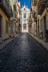 Fototapeta na wymiar Narrow streets, old houses in the old town of Bairro Alto, no balconies and shops, in the capital Lisbon in Portugal, Europe