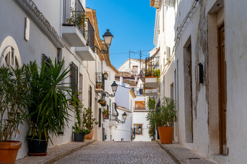 narrow street with whitewashed house fronts in the historic town center of Altea on the Coasta Blanca of Spain