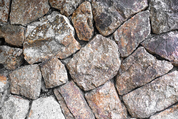 Stony background, texture. Large stones lie tight to each other