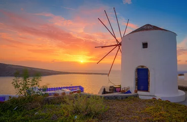 Fototapeten windmill at beautiful sunset on oia Santorin © Madlen Steiner