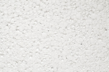 Expanded polystyrene foam small porous material white cells circle, close-up, representing foamed, uniform texture pattern.