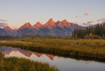 Fototapeta premium Scenic Sunrise LAndscape Reflection in the Tetons in Autumn