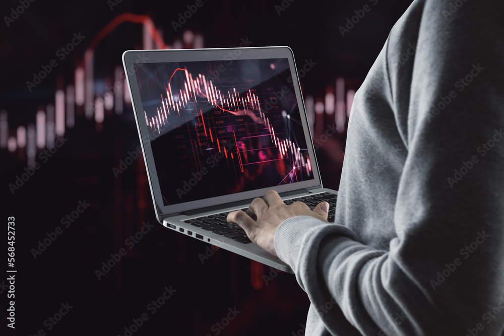 Poster Close up of hacker hands using laptop with glowing falling red forex chart on dark background. Stock exchange, hacking and crisis concept.