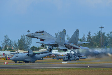 Fototapeta na wymiar Military aircraft performing at Langkawi Airport