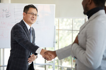 businessman shaking hands from success at work or project in the office