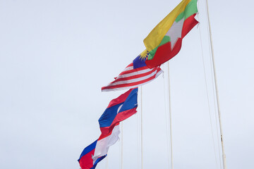 The flags of Association of Southeast Asian Nations or ASEAN over the clear blue sky. 