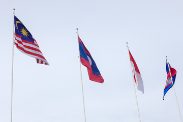 The flags of Association of Southeast Asian Nations or ASEAN over the clear blue sky. 