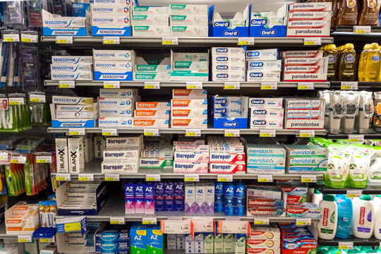 Italy - February 5; 2023: Various types and brands of toothpaste displayed on Italian supermarket shelf