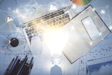 Social network hologram drawings over computer on the desktop background. Top view. Multi exposure. Concept of people connection.