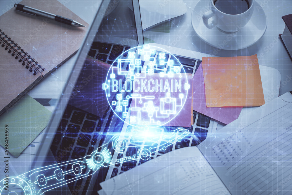 Poster blockchain theme hologram drawings over computer on the desktop background. top view. multi exposure