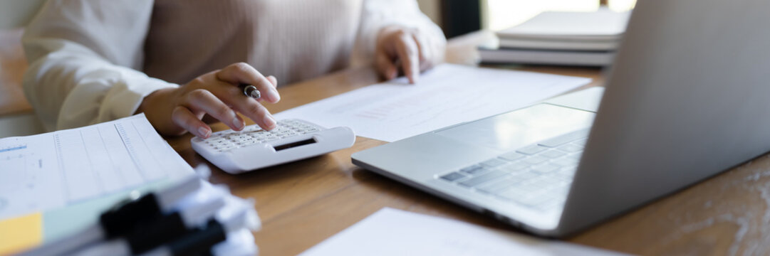 Business Professional Chartered Accountant Woman working with computer and calculator Sales Invoice Accounting