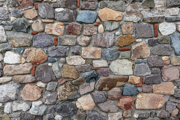 Stone masonry wall as an abstract background.