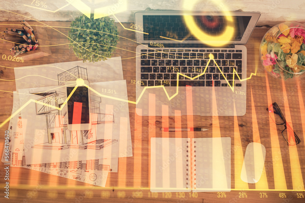 Poster stock market graph and top view computer on the table background. double exposure. concept of financ