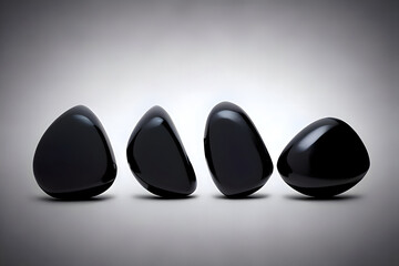 black stones in a row, standind stones on white background, zen stones, shiny black stones, spa stones, massage stones, wallpaper