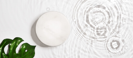 Transparent and clean white water background with podium and sunlight reflection