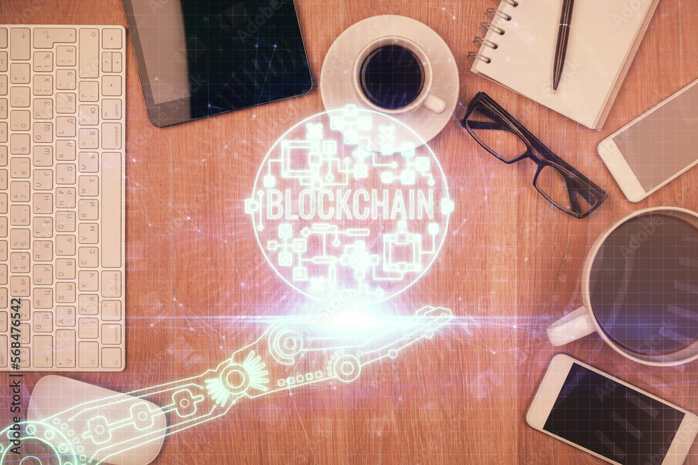 Poster Double exposure of blockchain theme hologram over table with phone. Top view. Crypto technology concept.