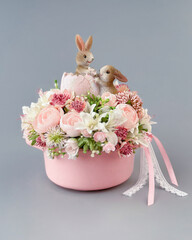 easter composition with hare and flowers isolated on gray background, easter decor