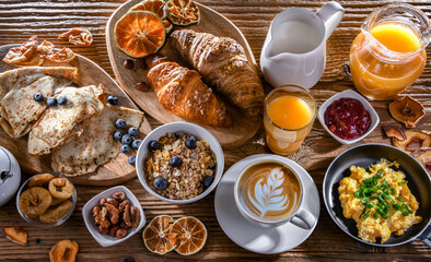 Breakfast served with coffee, eggs, cereals nd croissants