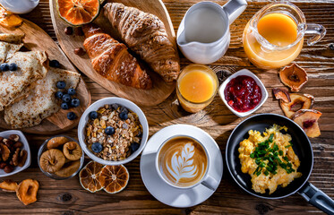 Breakfast served with coffee, eggs, cereals nd croissants