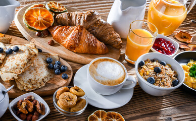 Breakfast served with coffee, eggs, cereals nd croissants