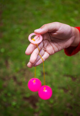 Selective focus photo of Lato-Lato, a traditional children's toy which is currently going viral, especially in Indonesia. Many children play this toy. 