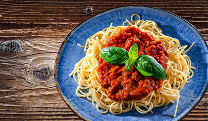 Composition with a plate of spaghetti bolognese