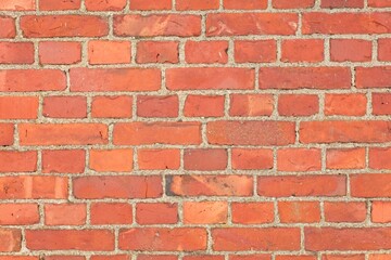 Closeup of detailed old red brick background wall texture.