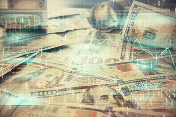 Multi exposure of forex chart drawing over us dollars bill background. Concept of financial success markets.