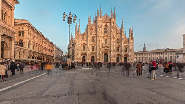 Panorama showing Milan Cathedral and Vittorio Emanuele gallery timelapse during sunset. Duomo di Milano is the cathedral church located at the Piazza del Duomo square in Milan city in Italy