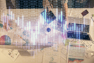 Multi exposure of man and woman working together and financial chart hologram. Business concept. Computer background.