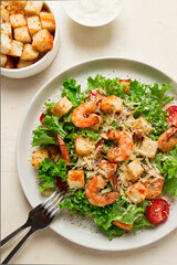 caesar salad, with shrimp, on a white background, homemade, no people,
