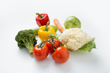 Fresh whole vegetables on a white table. Cooking, diet
