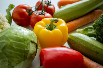 Fresh whole vegetables on a white table. Cooking, diet